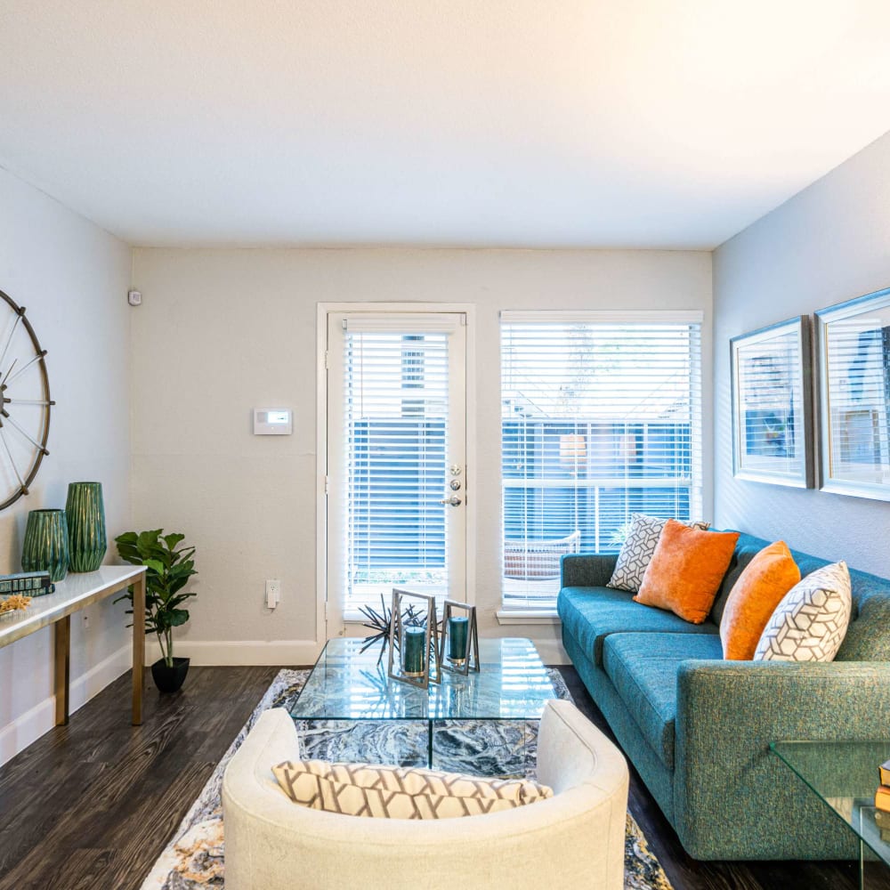 Lots of natural light and easy access to patio from living room at The Edge at Clear Lake in Webster, Texas