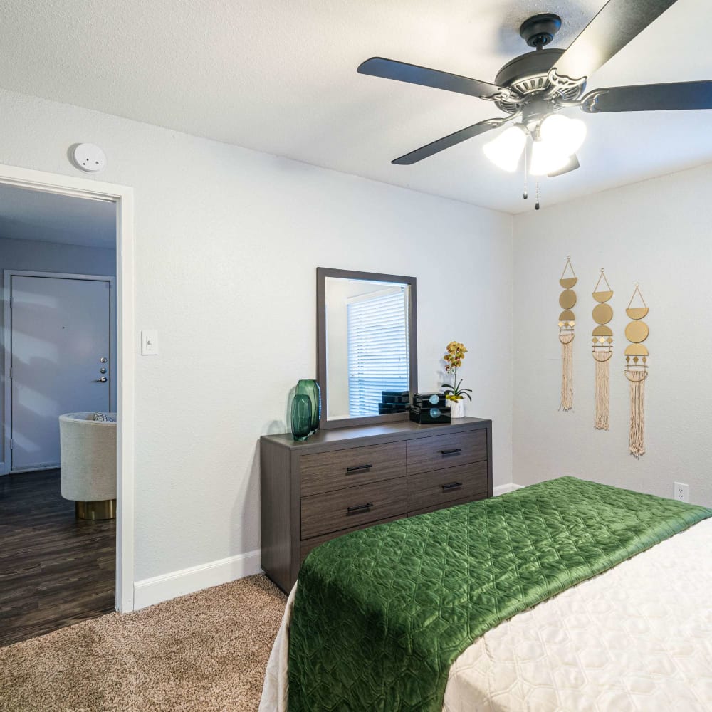 Bedroom with ceiling fan at The Edge at Clear Lake in Webster, Texas
