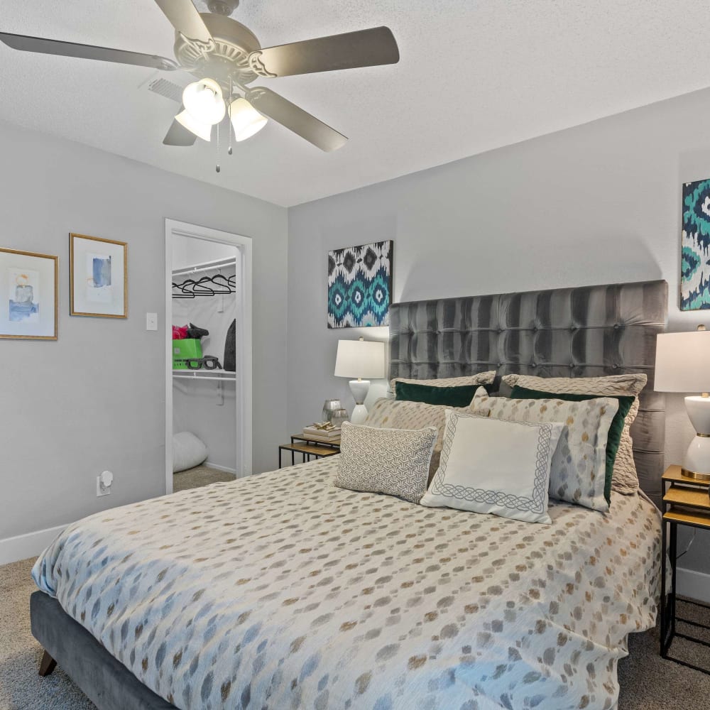 Bedroom with ceiling fan at The Hampton on Jupiter in Dallas, Texas