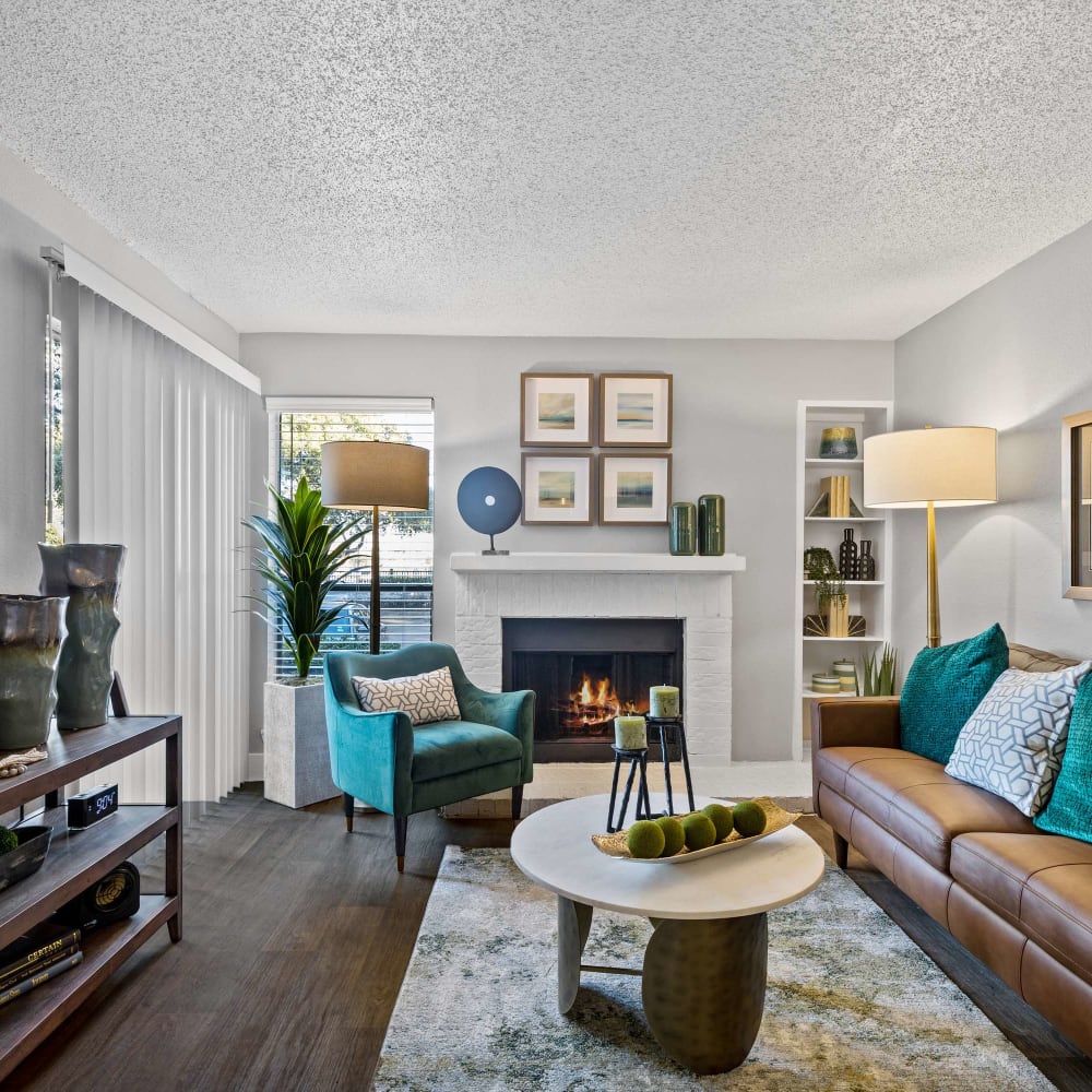 Open living space with wood-style flooring at The Hampton on Jupiter in Dallas, Texas