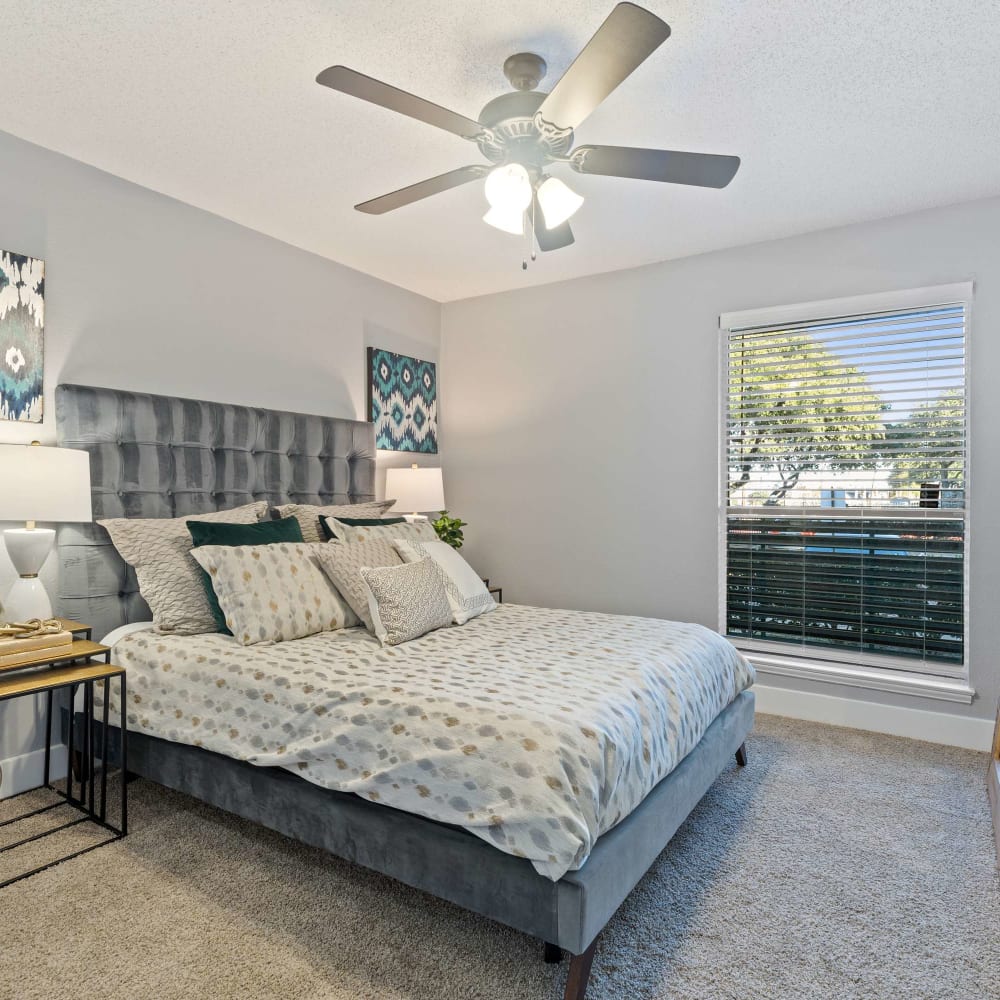 Bedroom with plush carpeting at The Hampton on Jupiter in Dallas, Texas