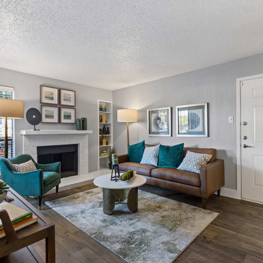 Living room featuring a fireplaceat The Hampton on Jupiter in Dallas, Texas