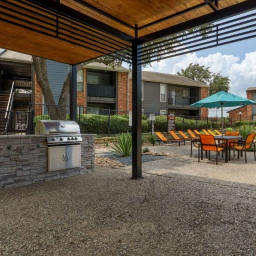 Community patio with poolside views at The Hampton on Jupiter in Dallas, Texas