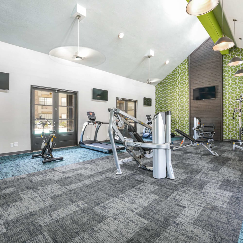Fitness center with lots of exercise equipment at The Madison on the Lake in Houston, Texas