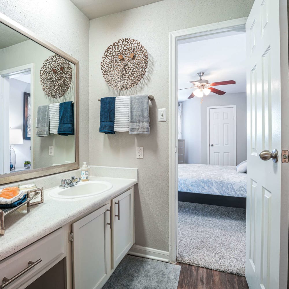 Bathroom with wood-style flooring at The Madison on the Lake in Houston, Texas