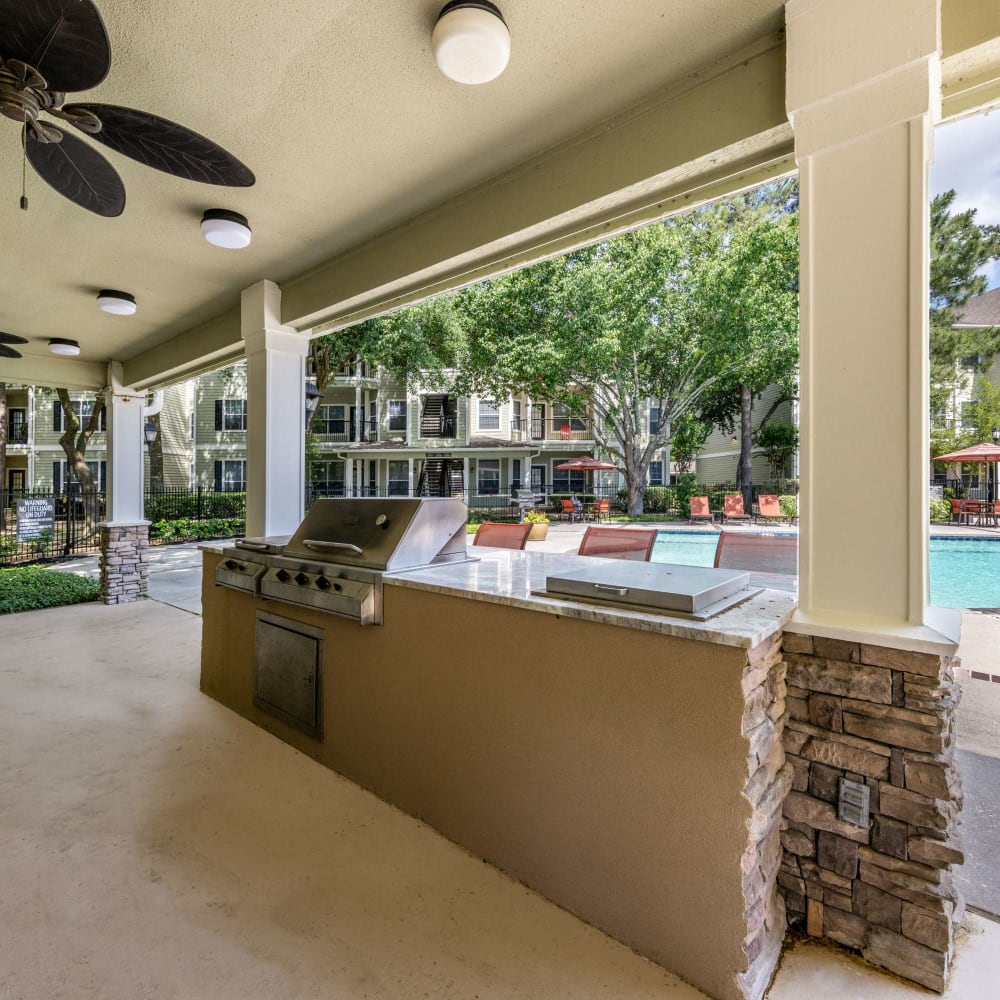 Pool side seating and gathering space at The Pines on Spring Rain in Spring, Texas