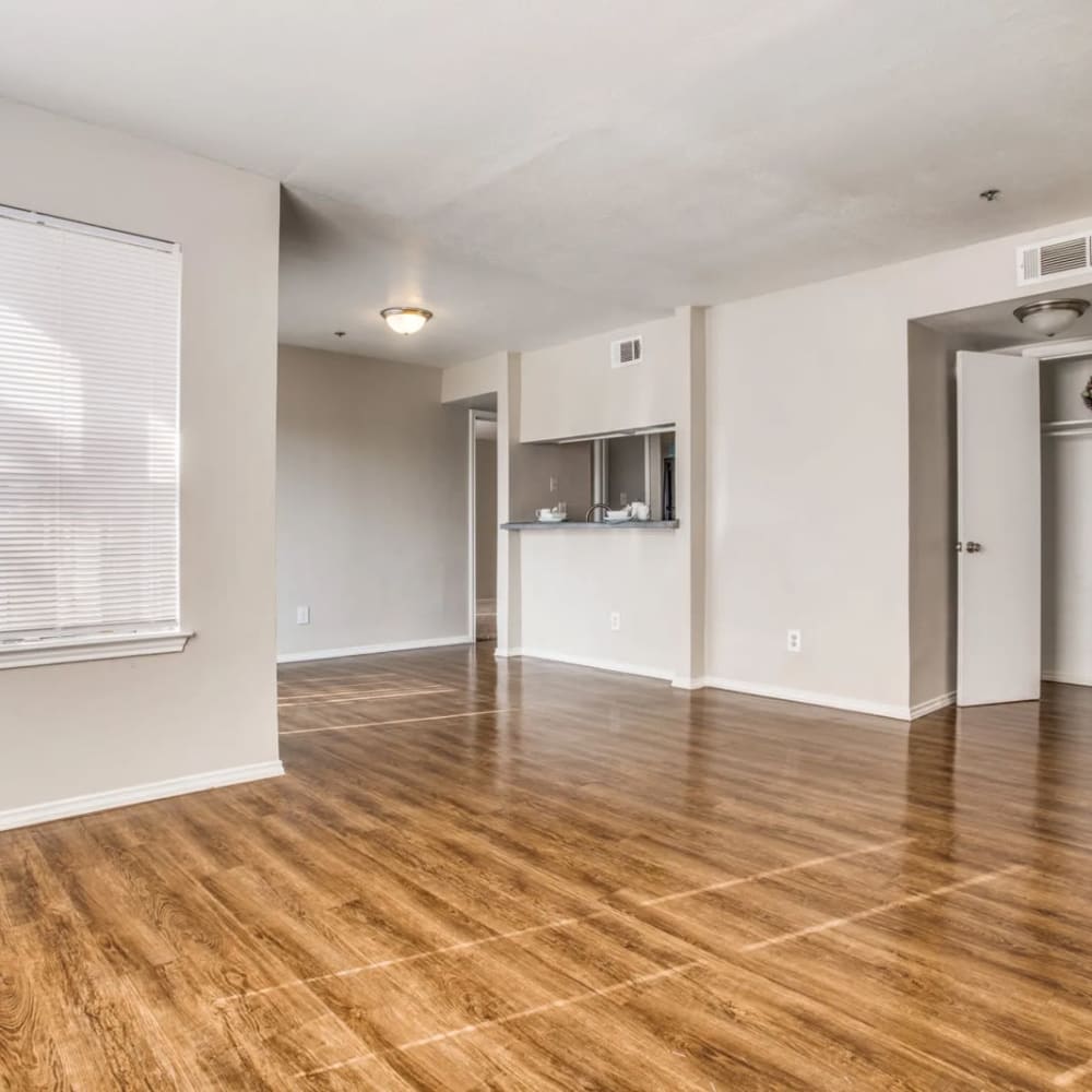 Empty apartment front room with hardwood floor at The Declan in Dallas, Texas