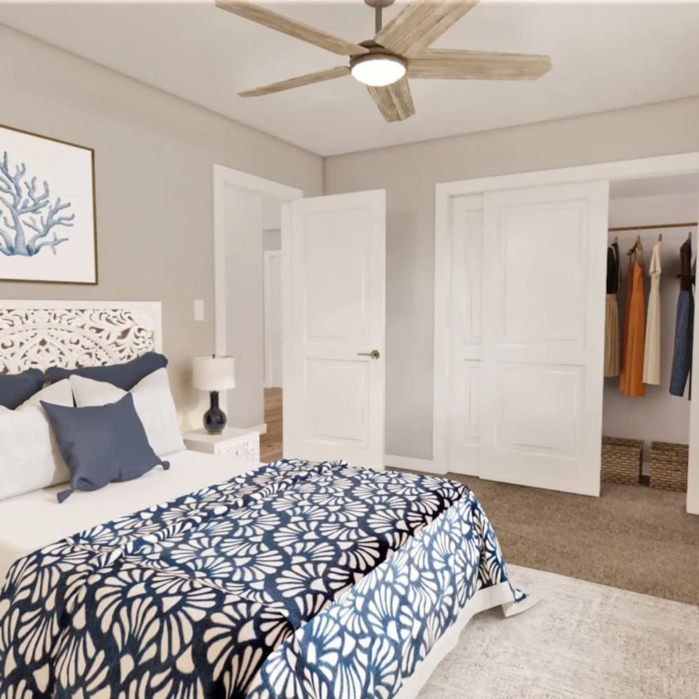 A render of a cozy bedroom with ceiling fan in a model home at The Lyle in Fort Walton Beach, Florida