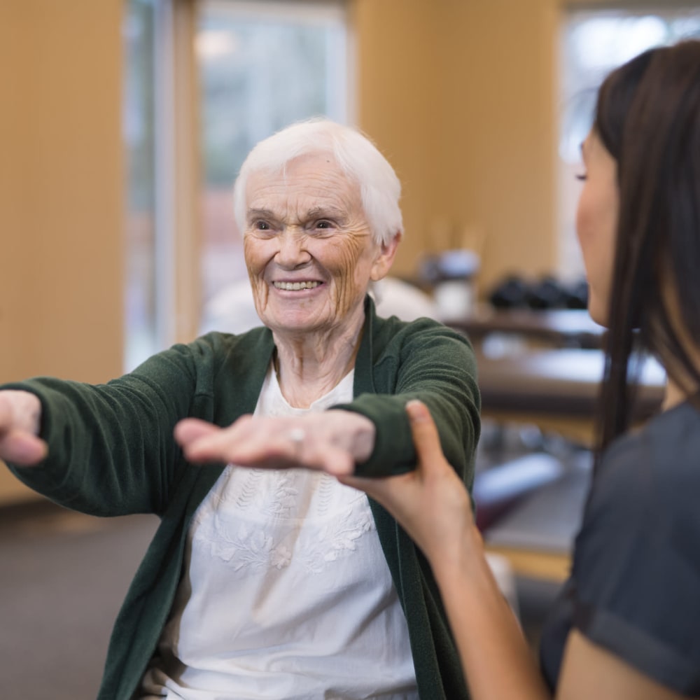 A resident stretching at The Ridge at Lansing in Lansing, Michigan