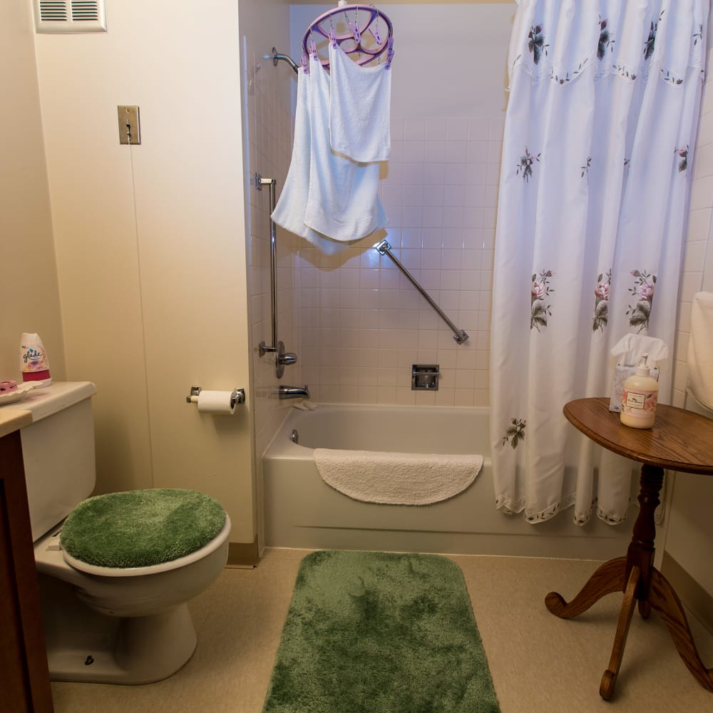 Model bathroom with a large shower at Connellsville Towers in Connellsville, Pennsylvania