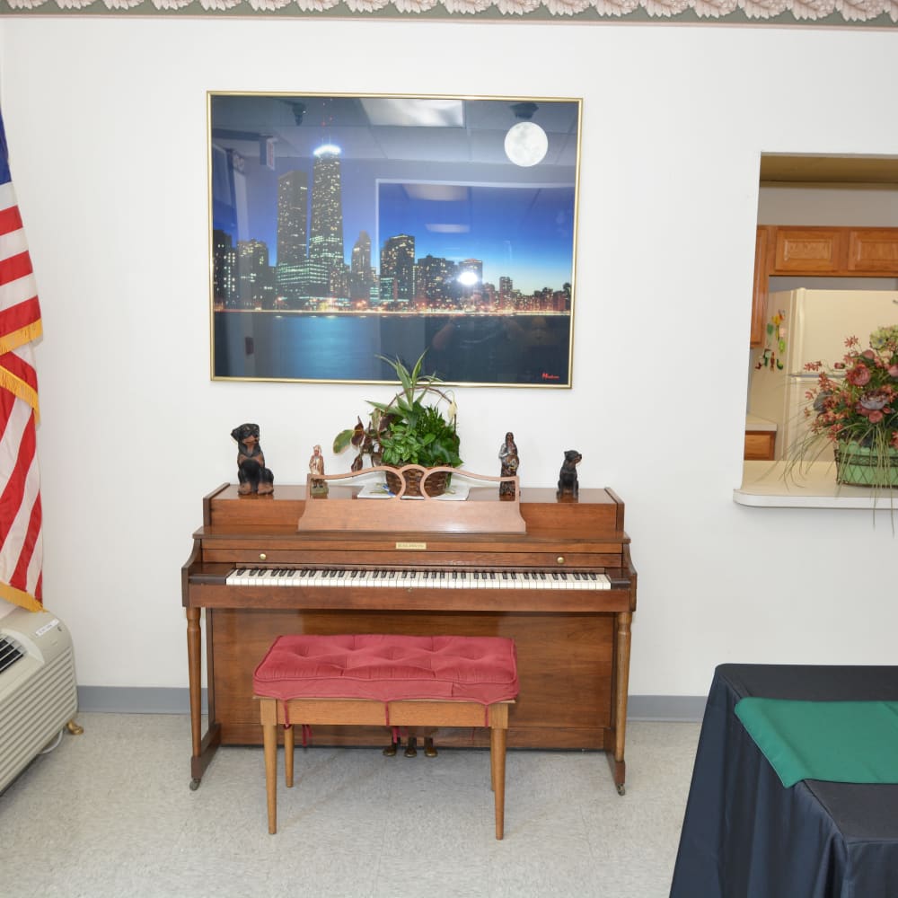 Resident club house with a piano at Buckeye Towers in New Boston, Ohio