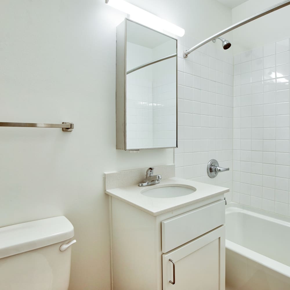 Model bathroom with white walls at BJ Wright Court Apartments in Chicago, Illinois