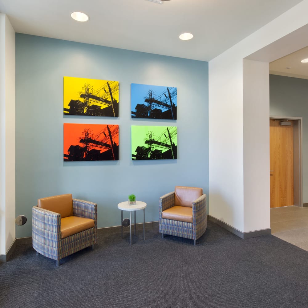 Gathering area with wall art at Metro Green Residences in Stamford, Connecticut