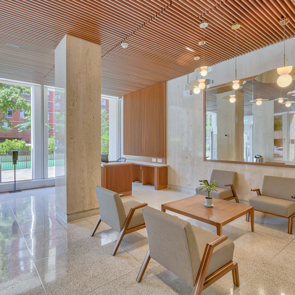 Lobby area with seating and coffee table at Tower West Apartments in New York, New York