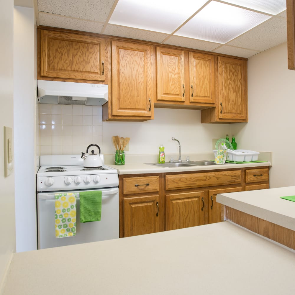 Model kitchen with light-wood accents at Plymouth Square Village in Detroit, Michigan