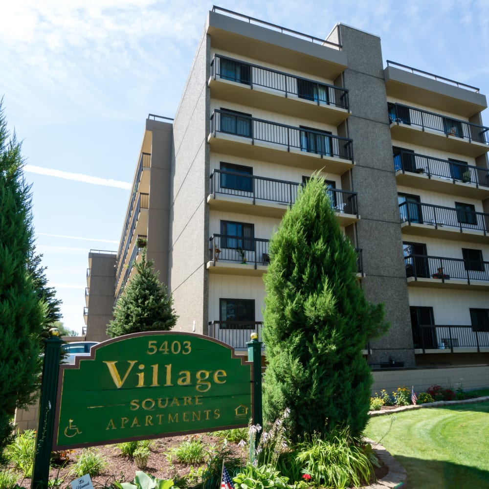 Courtyard and building exterior at Village Square Apartments in Williamsville, New York