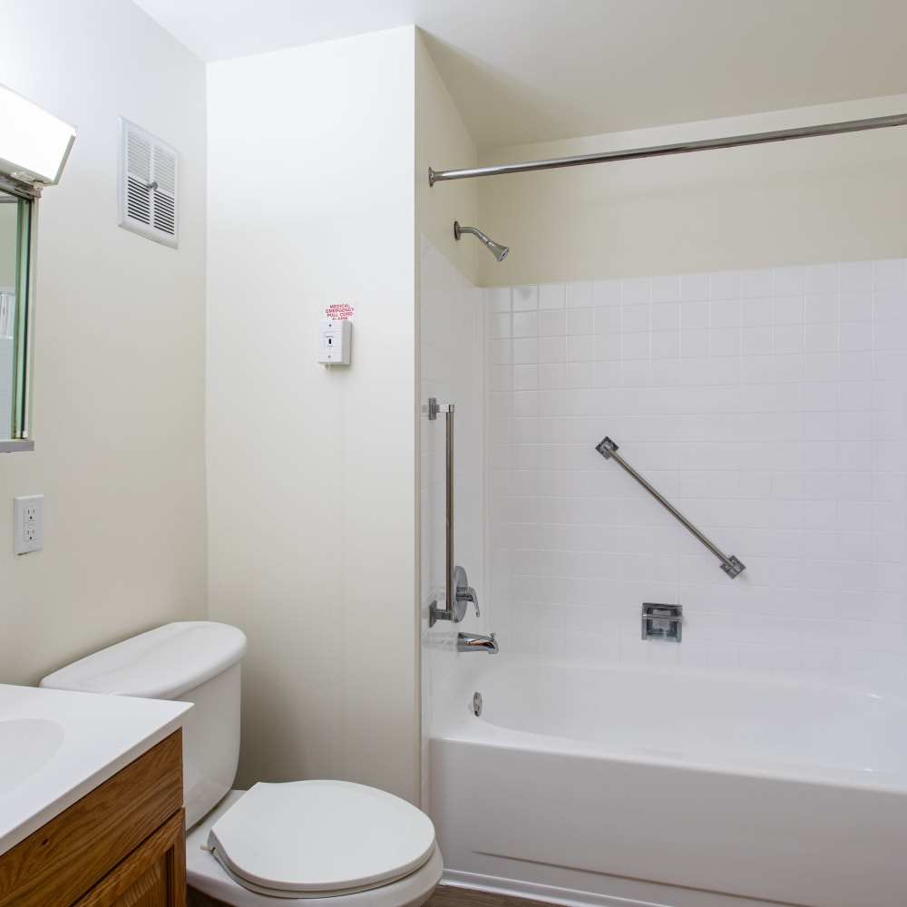 Bathroom with a vanity and tub/shower combination in a model home at Coraopolis Towers in Coraopolis, Pennsylvania