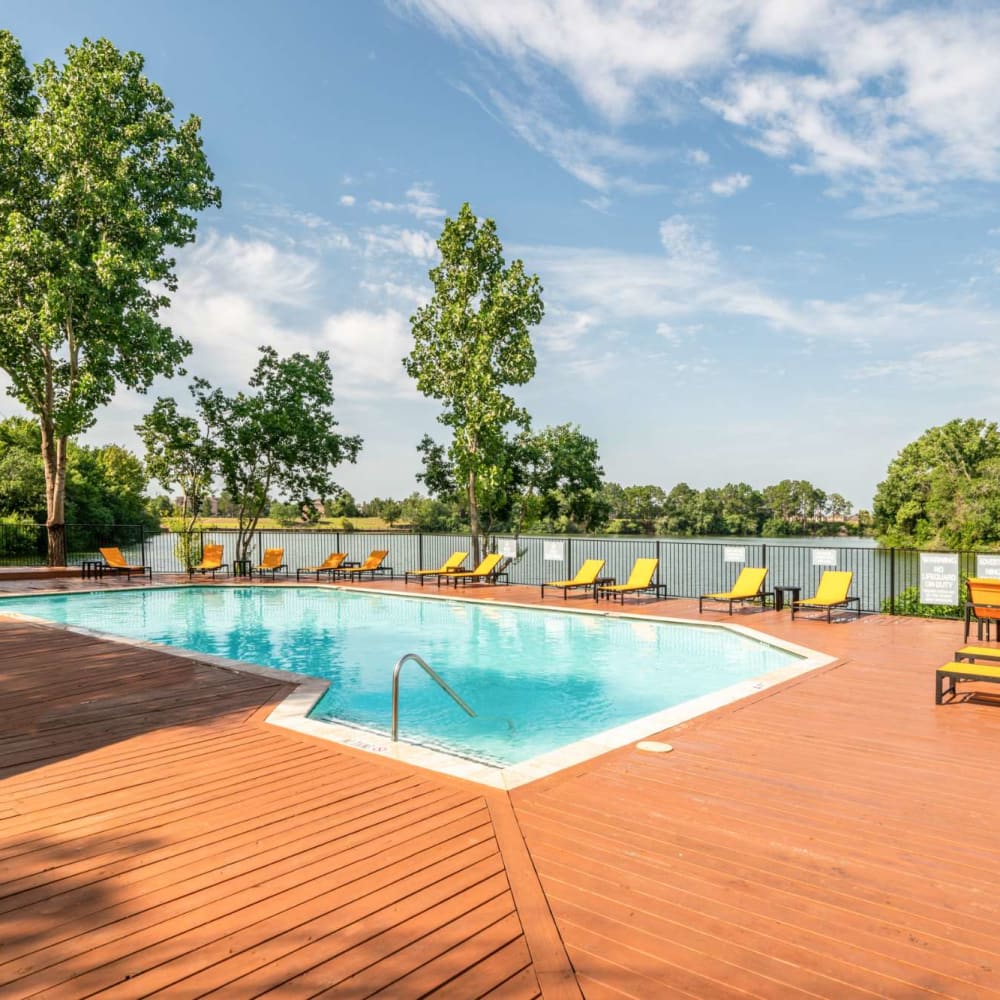 Poolside lounge chairs at The Madison on the Lake in Houston, Texas