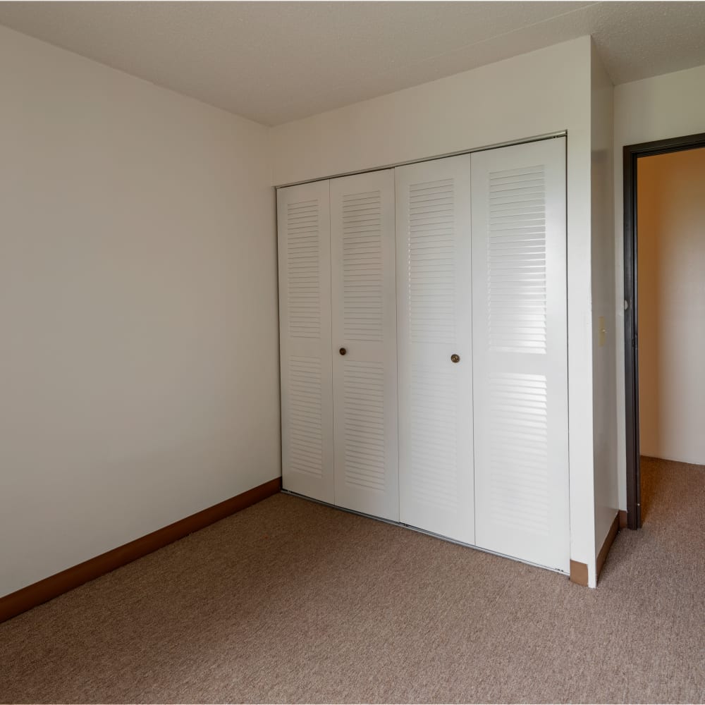 Bedroom with closet at Autumn Ridge Village in Sterling Heights, Michigan