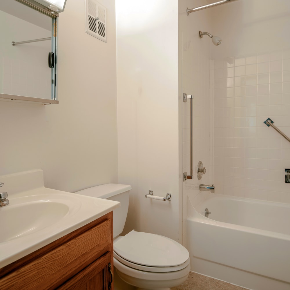Bathroom with a tub/shower combination in a model home at Autumn Ridge Village in Sterling Heights, Michigan