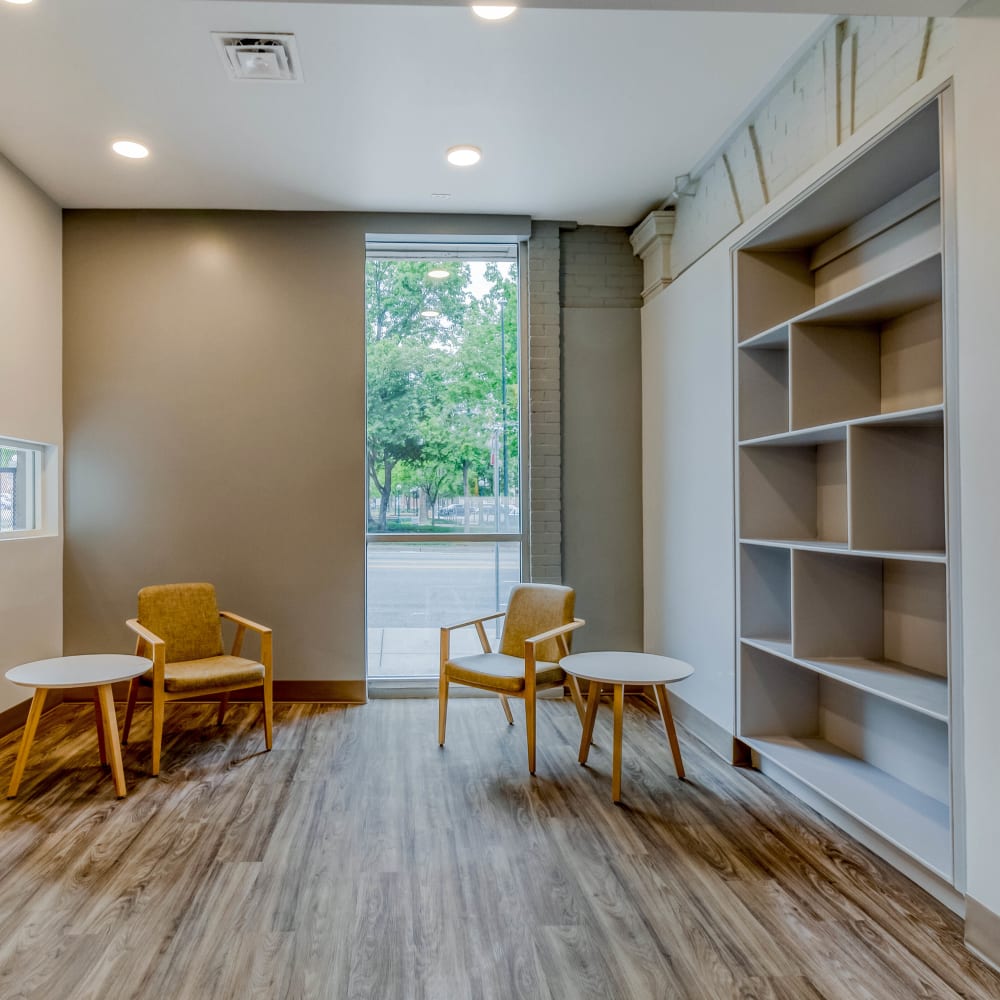 Resident seating area with shelving at Argonaut/El Tovar Apts in Denver, Colorado