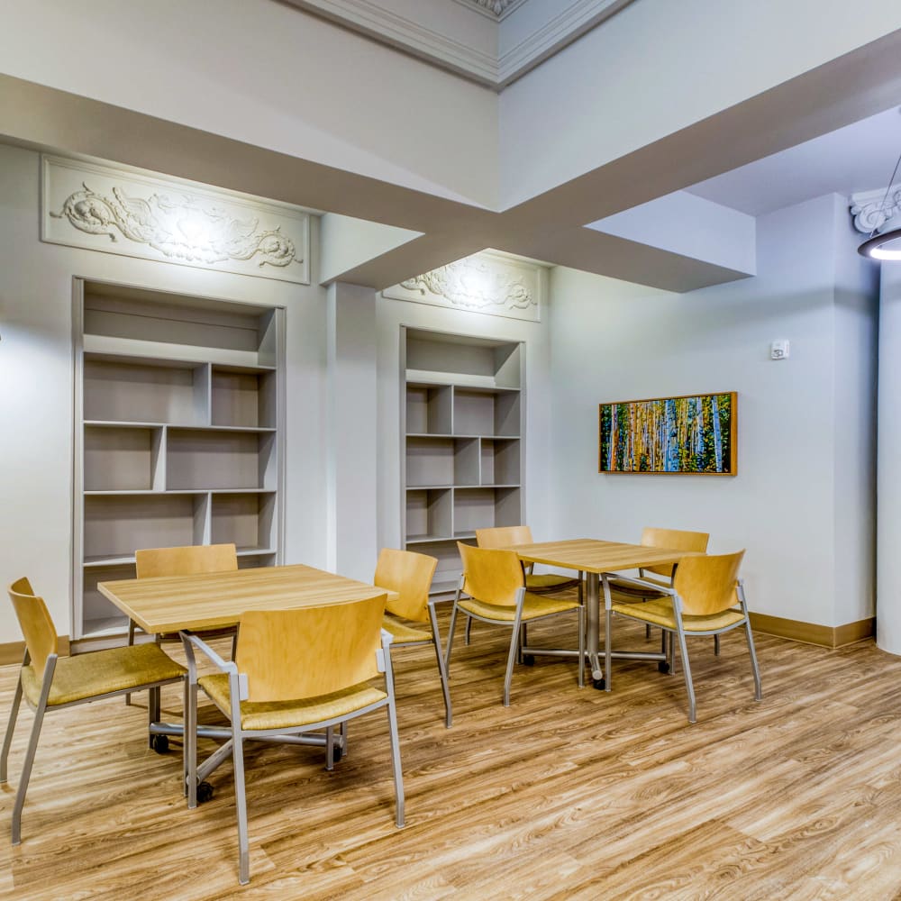 Resident seating area with tables at Argonaut/El Tovar Apts in Denver, Colorado