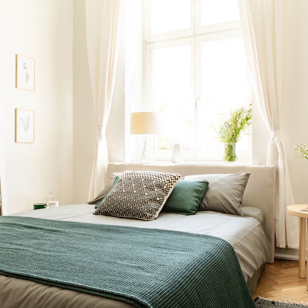 Cozy bedroom in a model home at The Cordelia in Fort Walton Beach, Florida