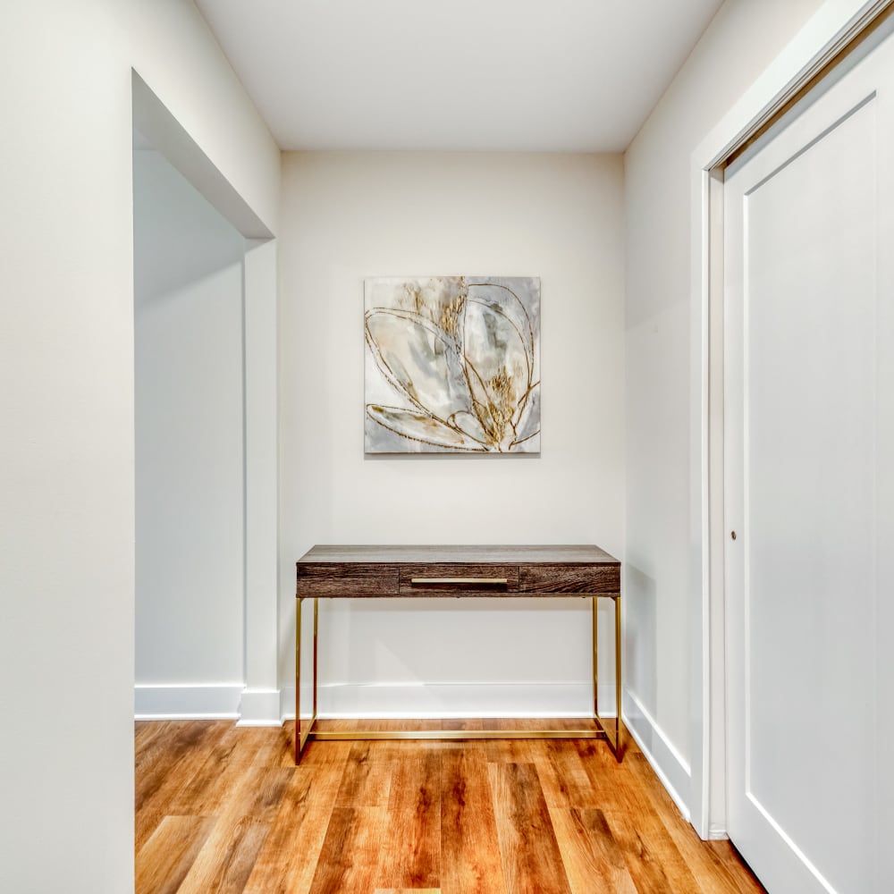 Wooden table and a painting at Fox Plan Apartments, Monroeville, Pennsylvania