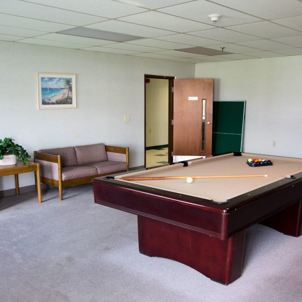 Community room with pool table at Oceanpointe Towers in Long Branch, New Jersey