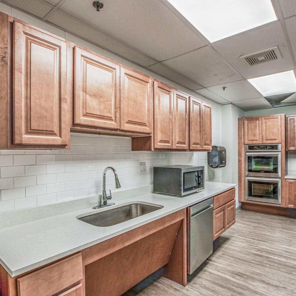 Resident kitchen with double ovens at Lakeland Place in Waterford, Michigan