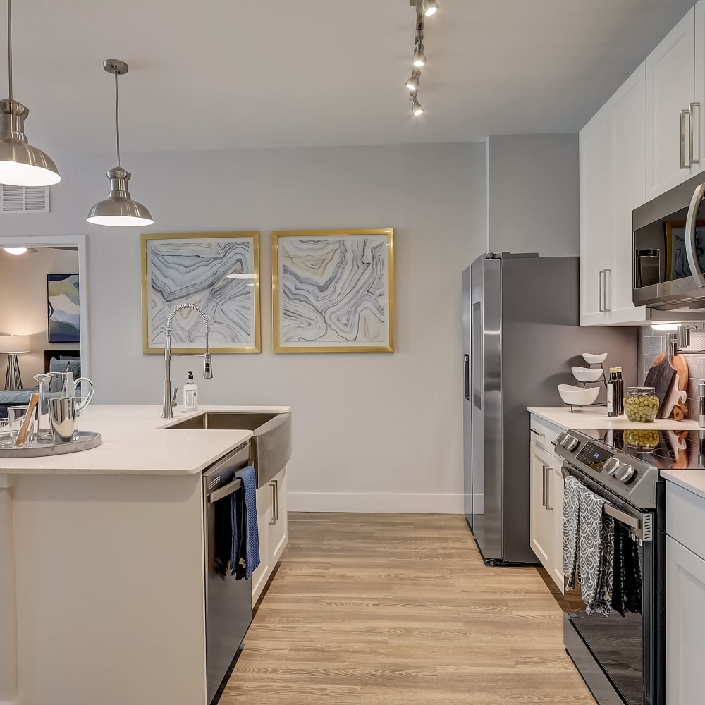 Stainless steel appliances in an apartment kitchen at Mallory Square at Lake Nona in Orlando, Florida