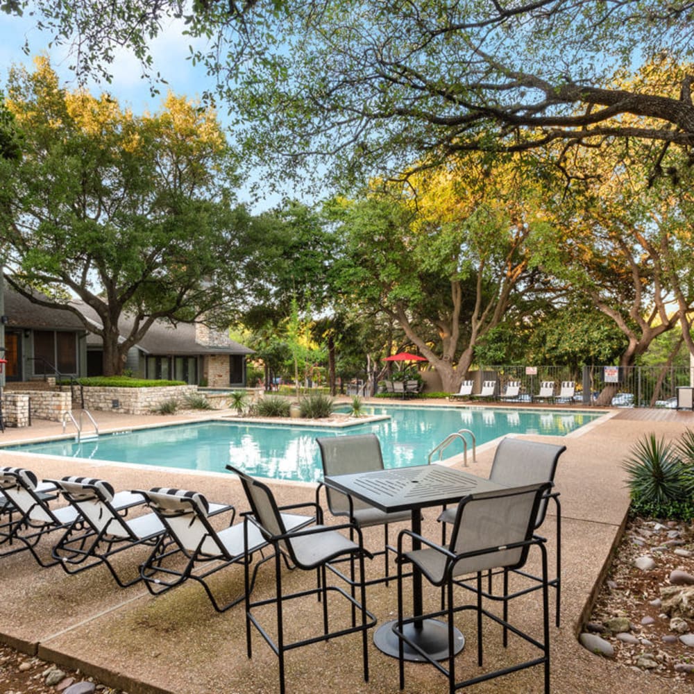 Poolside table and chairs at Landmark at Barton Creek in Austin, Texas