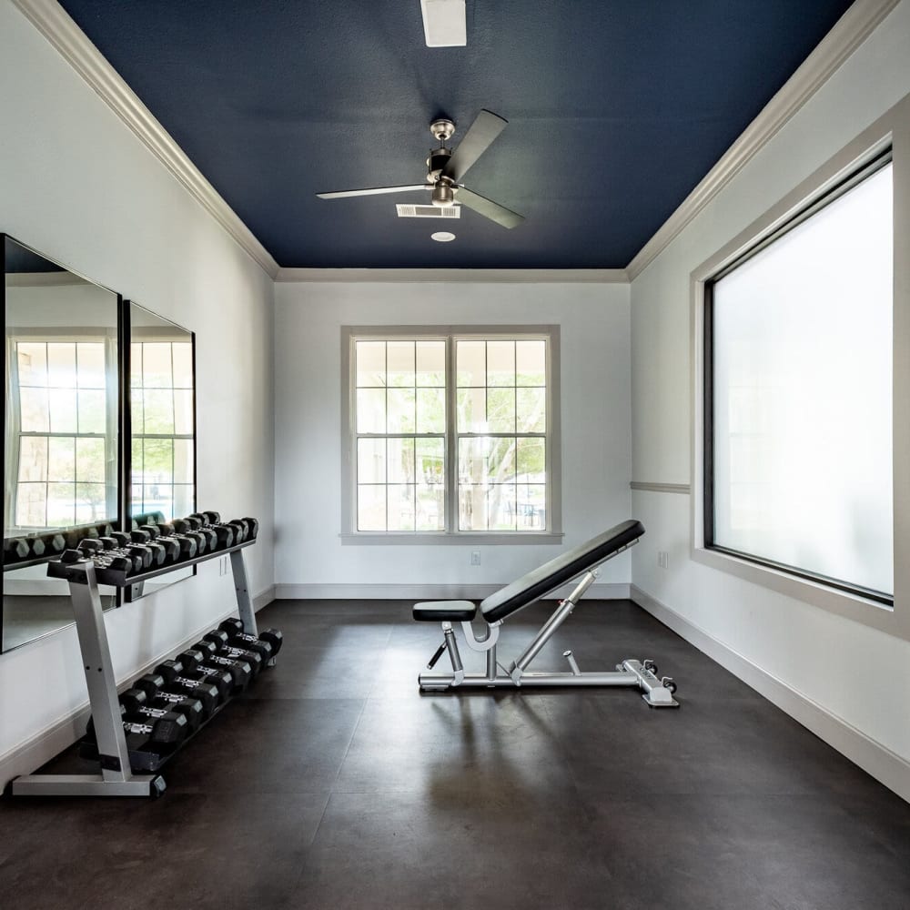 Fitness center with free weights at Mission Ranch in Mesquite, Texas