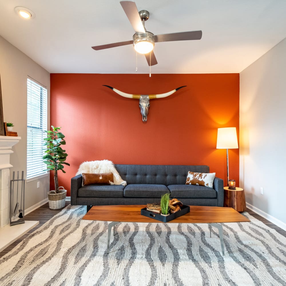 Resident living space with a ceiling fan at Mission Ranch in Mesquite, Texas