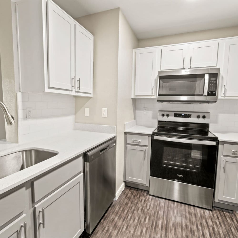 Kitchen with a dishwasher at Ellie Apartments in Austin, Texas