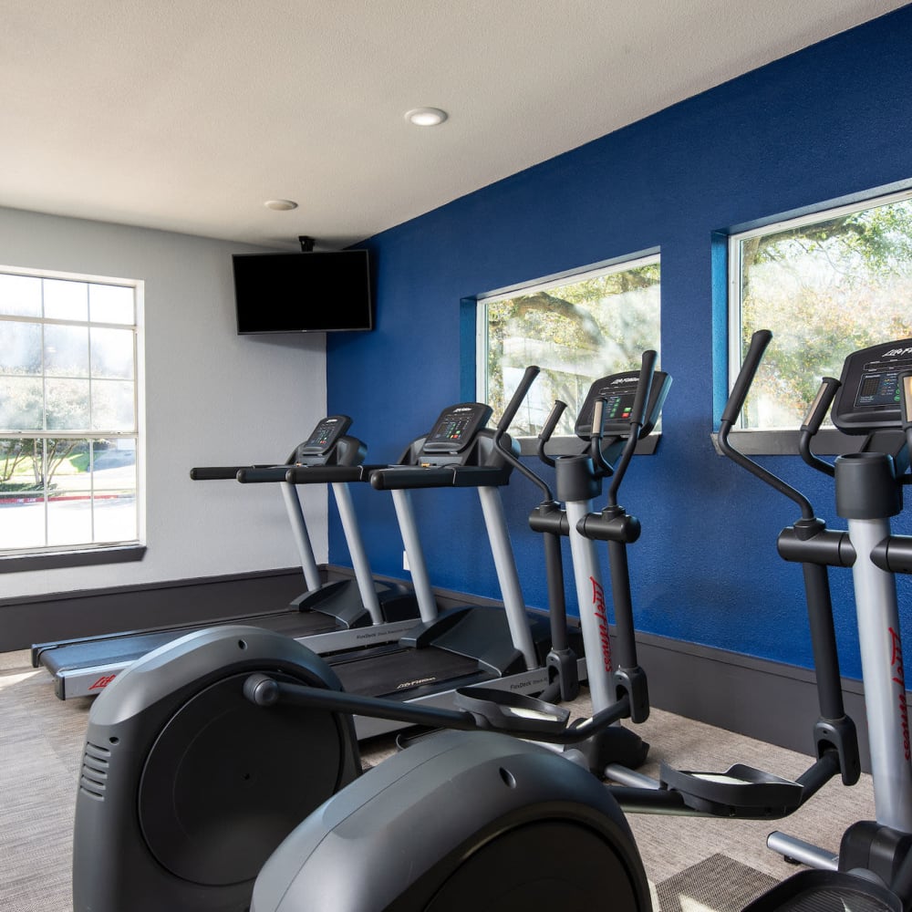 Fitness center with stair steppers at Ellie Apartments in Austin, Texas