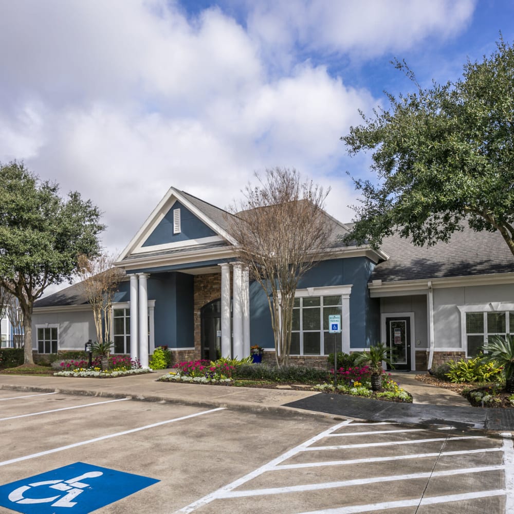 Clubhouse with handicap parking at Villas at West Road in Houston, Texas
