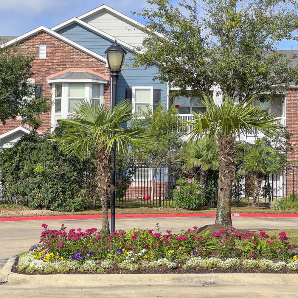 Trees and flowers at Villas at West Road in Houston, Texas