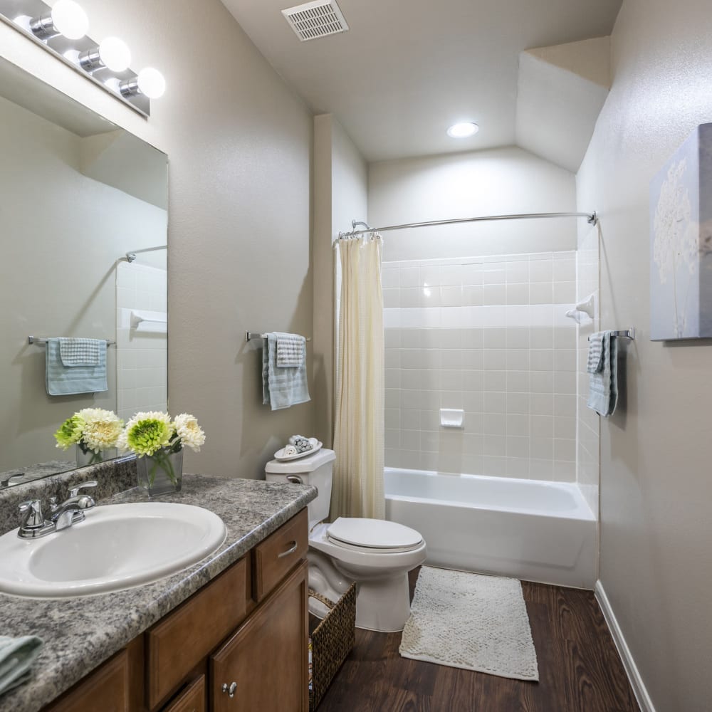 Resident bathroom with great lighting at Villas at West Road in Houston, Texas