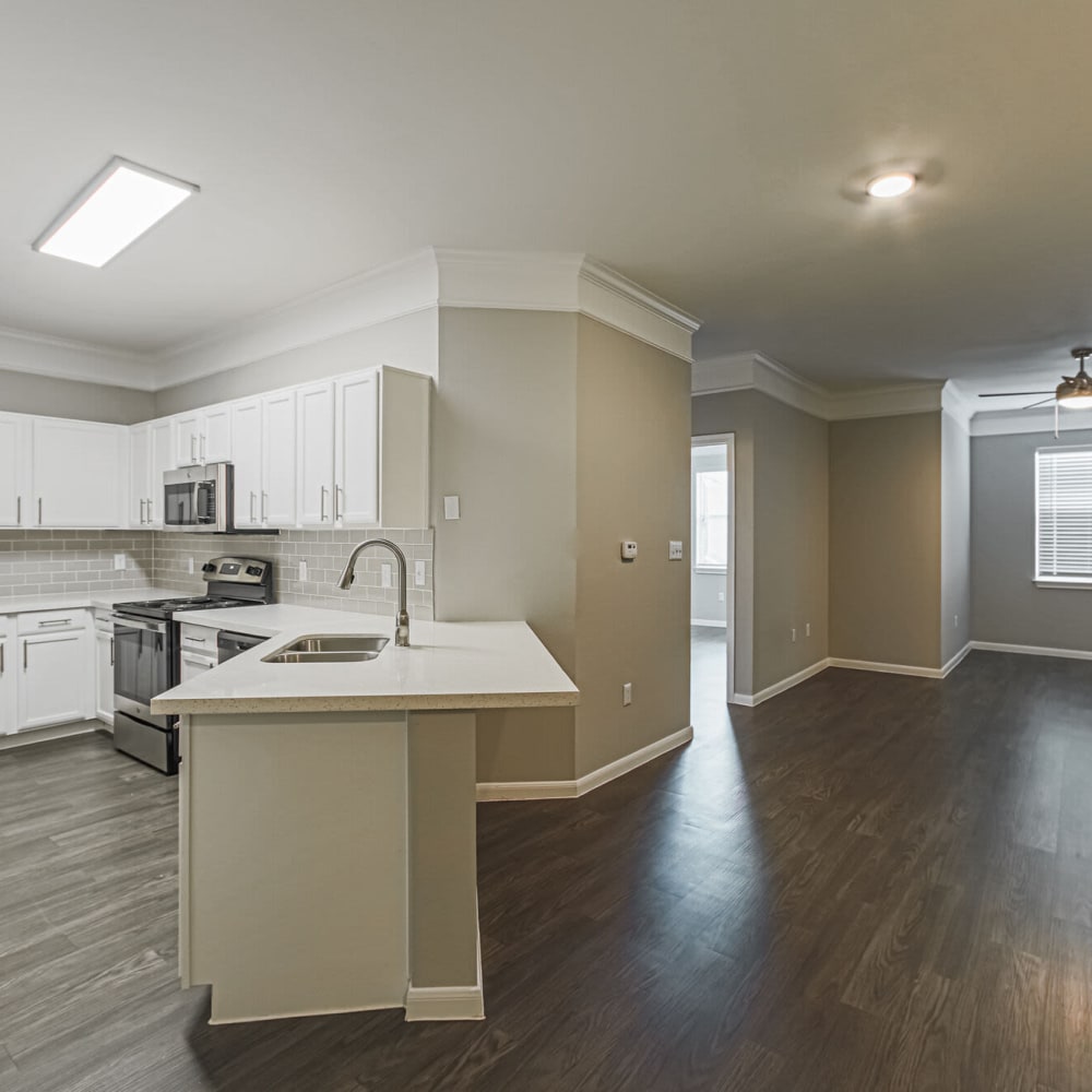 Counter between the kitchen and main living space at Villas at West Road in Houston, Texas