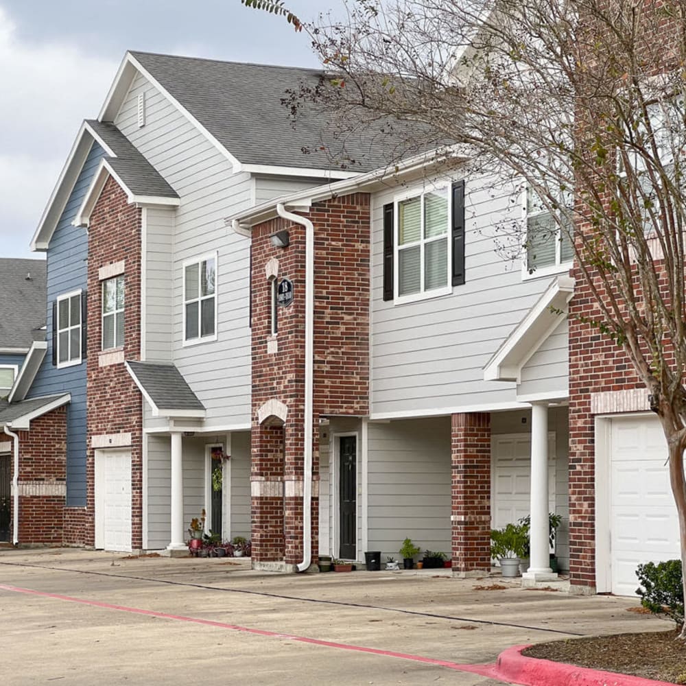 Exterior view of apartments with garages at Villas at West Road in Houston, Texas