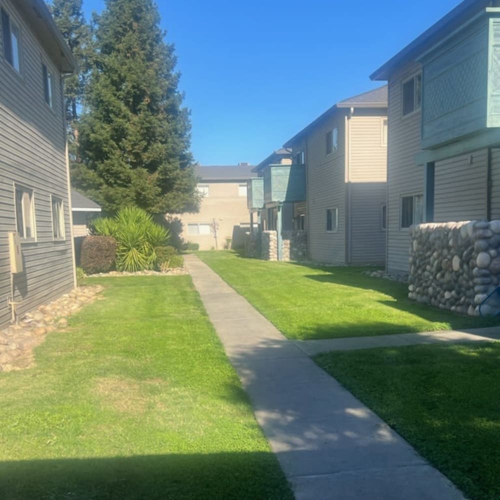Path between buildings at Abbey Pointe Apartments in Stockton, California