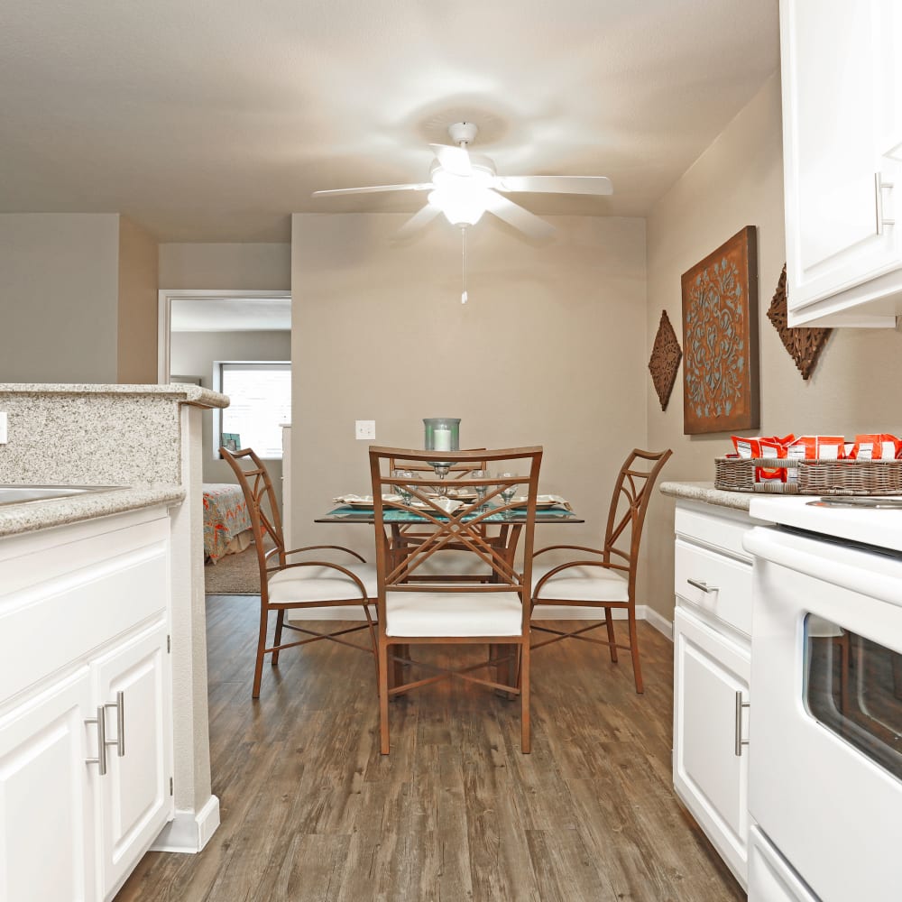 Kitchen with granite countertops and a dining table at Greenback Ridge in Citrus Heights, California