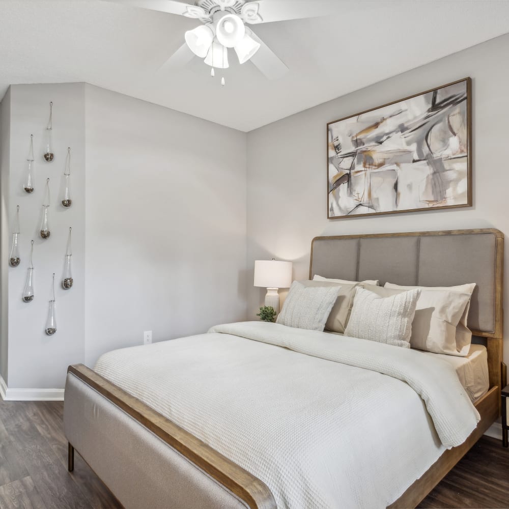 Large model bedroom with a fan and wood-style flooring at Hawthorne Gates in Atlanta, Georgia