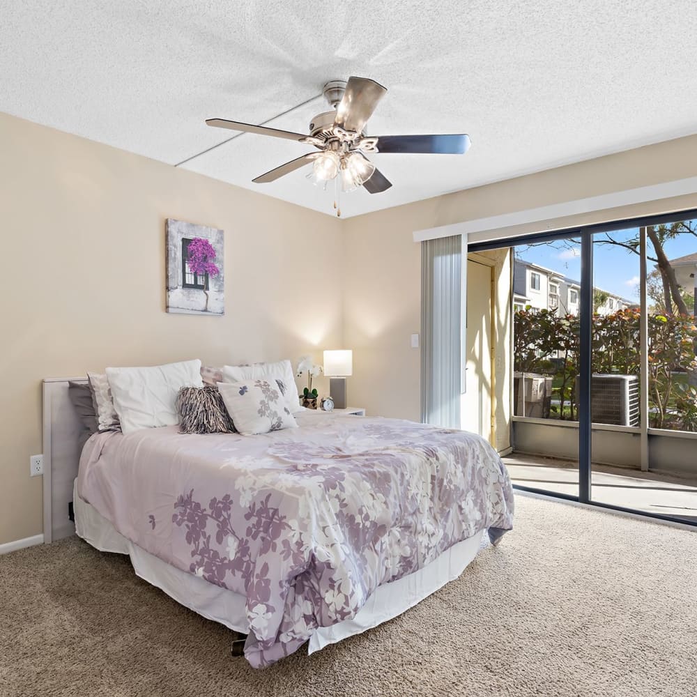 Master bedroom with access to the balcony at Estates at Countryside in Clearwater, Florida