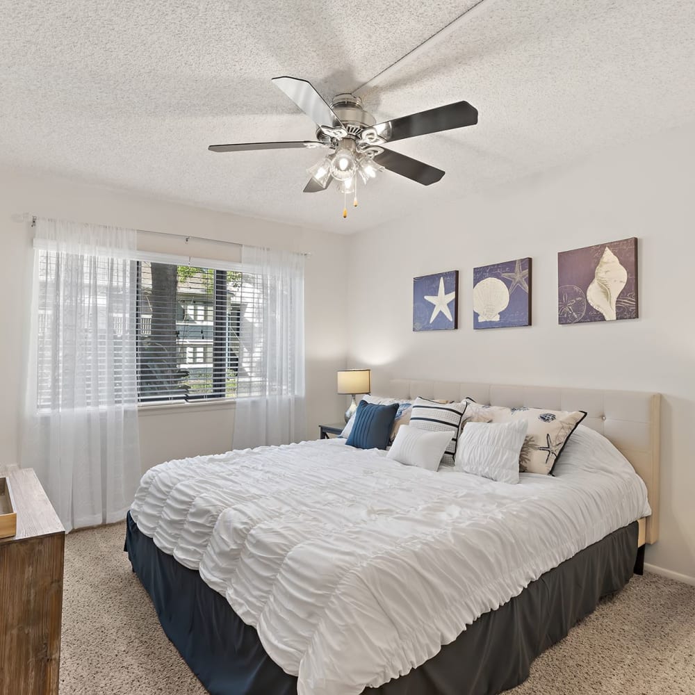 Bedroom with a ceiling fan at Estates at Countryside in Clearwater, Florida