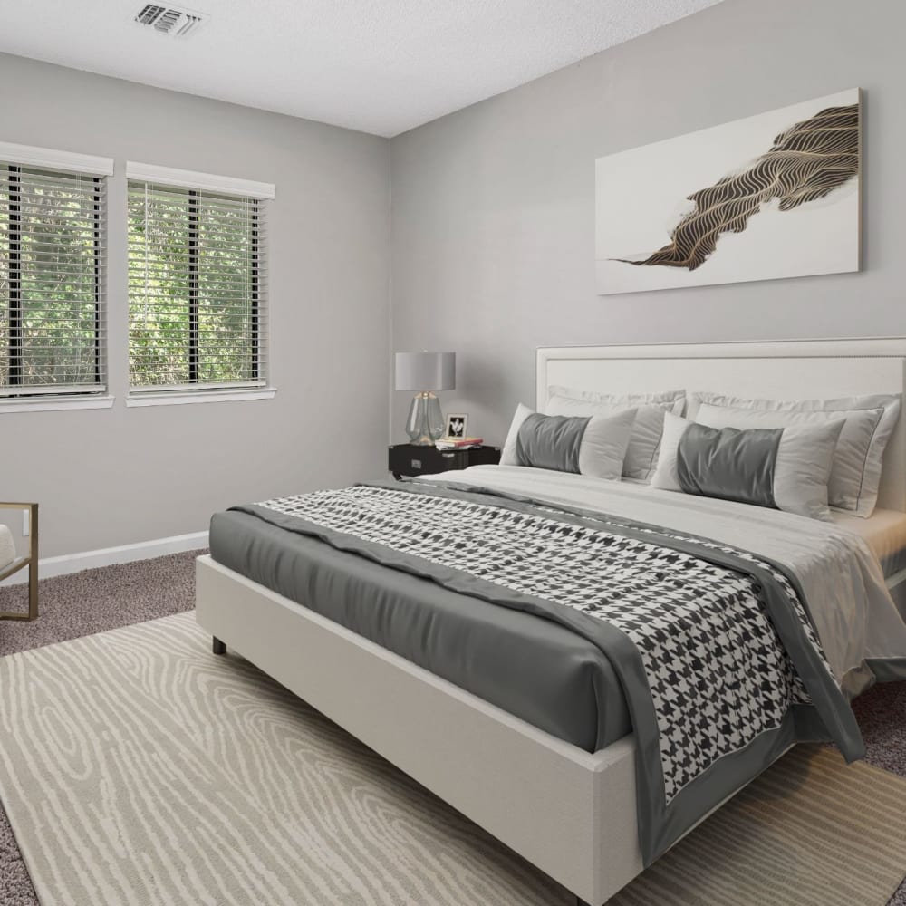 Master bedroom with wood-style flooring at Lakeview at Palm Harbor in Palm Harbor, Florida