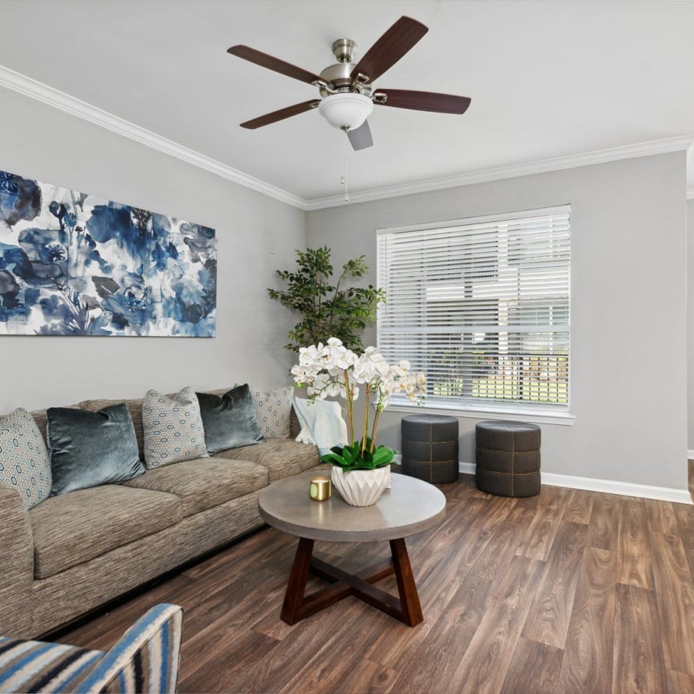 Wood flooring in a furnished apartment living room at Discovery at West Road in Houston, Texas