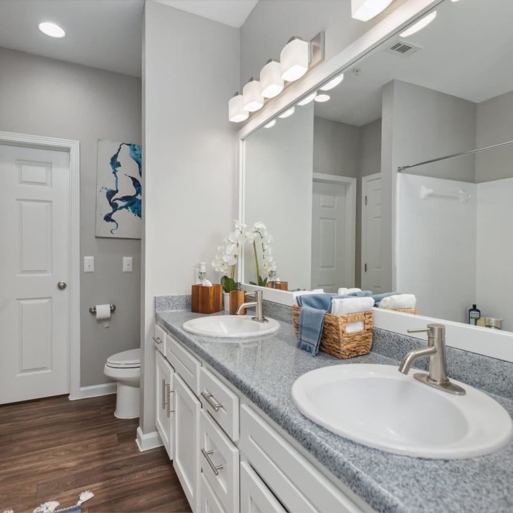 A double vanity in an apartment bathroom at Discovery at West Road in Houston, Texas