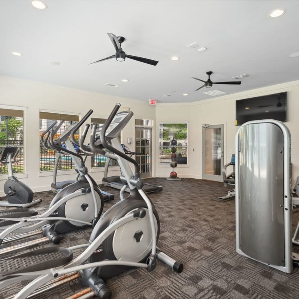 Exercise equipment in the fitness center at Discovery at West Road in Houston, Texas